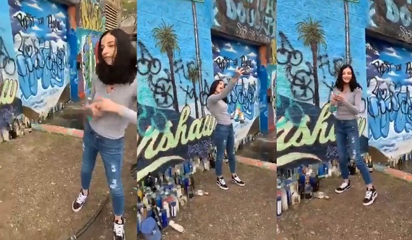 Disrespectful Chick Caught Vandalizing Nipsey Hussle's Mural & Takes Selfies