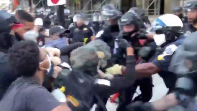 "Take his a**": Peaceful Protesters Hand Rioter Over To The Police For Destroying Property