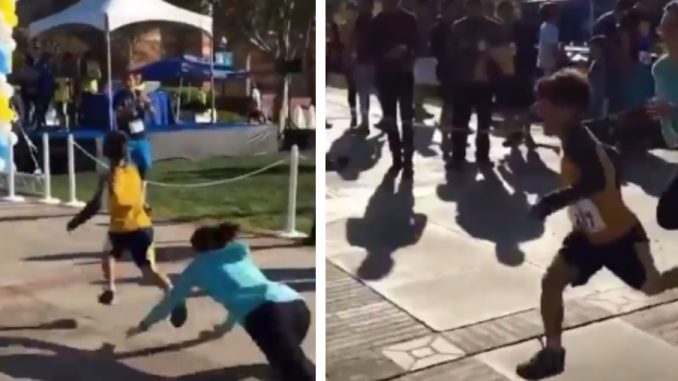 'Karen' Eats The Concrete While Trying To Stop Kid From Crossing Finish Line