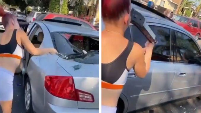 Female Takes a 'Mean One' To The Face While Destroying Someone's Car