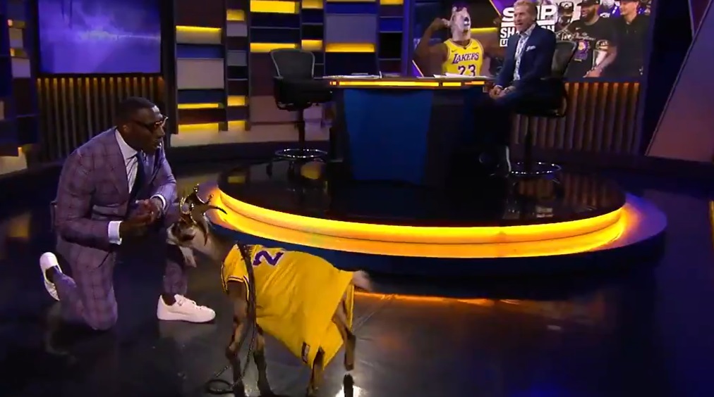 Shannon Sharpe dressed as GOAT James, with a LeBron jersey and a goat mask