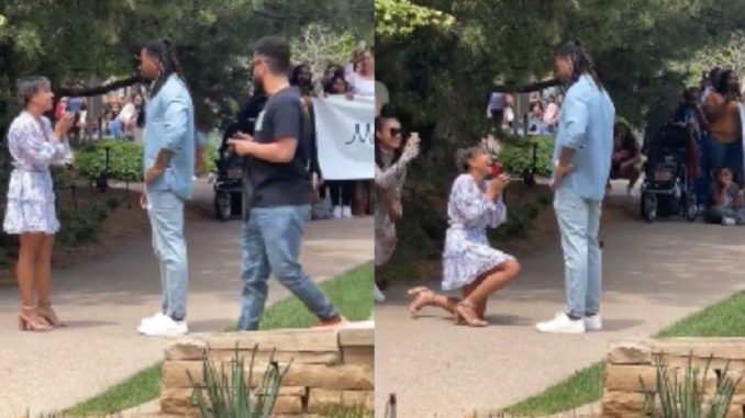 Woman Has A Team Of Friends Supporting Her While She Proposes To Her Man