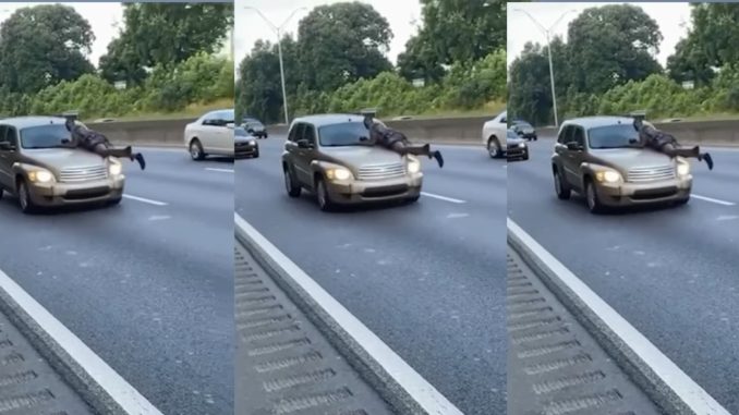 Shocking Video Shows Man Hanging Onto Hood of Car on Highway
