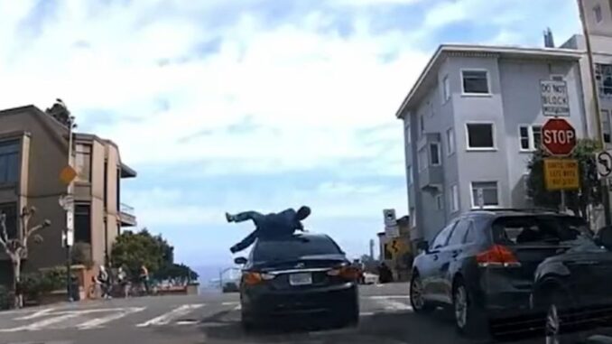 Crazy Video Shows Man Trying to Stop Car Burglary Get Flung On The Street