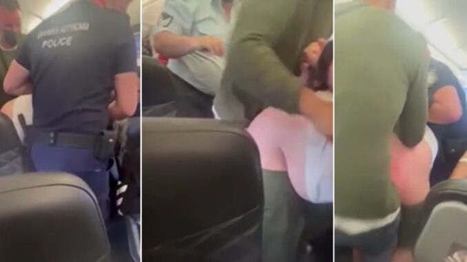 Shocking Moment Drunk Passenger Gets Dragged Off Plane After Peeing on His Brother