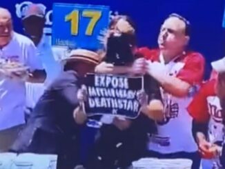 Joey Chestnut Choke-Slams Protestor Who Bumped Him During Hot Dog Eating Competition