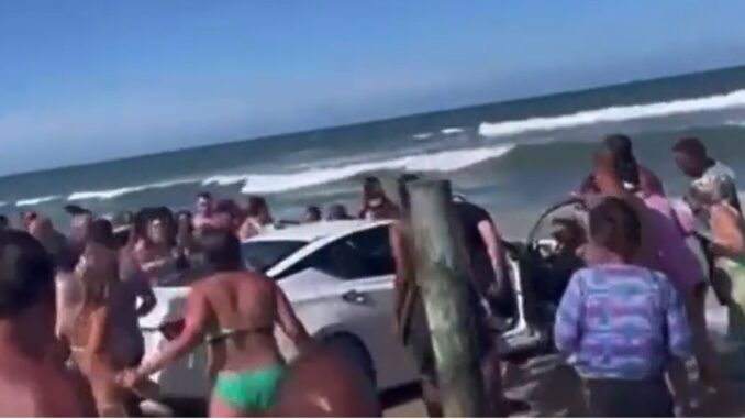 Multiple People Injured After Person Drives Through Crowd and Into Water at Daytona Beach!